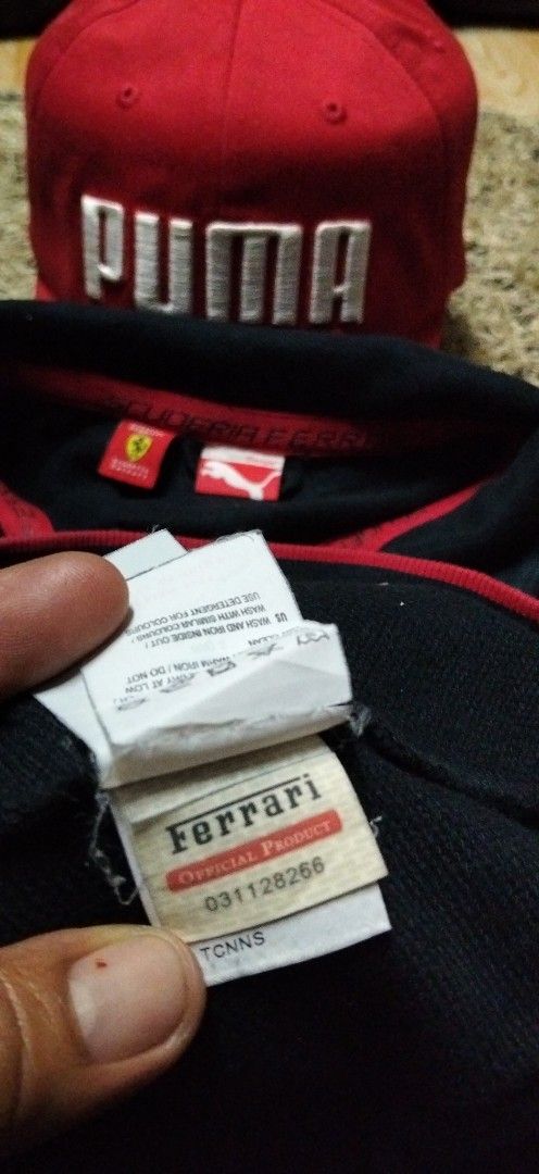 Puma Scuderia Ferrari Zip Jacket and Red Cap Bundle (Category: Coats, Jackets and Outerwear) located in Paranaque City. Submitted by michael-08 (Listing ID 1466756072, Image 3). Description: - Authentic Puma Scuderia Ferrari matching set - Black full-zip track jacket, Size Large, with official product tag, shield badge, and red detailing - Matching red Puma cap with bold white branding and curved brim - Meet-ups possible or shipping via J&T/Flash