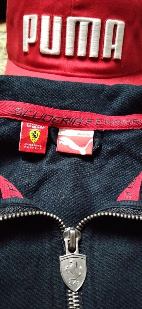 Puma Scuderia Ferrari Zip Jacket and Red Cap Bundle (Category: Coats, Jackets and Outerwear) located in Paranaque City. Submitted by michael-08 (Listing ID 1466756072, Image 2). Description: - Authentic Puma Scuderia Ferrari matching set - Black full-zip track jacket, Size Large, with official product tag, shield badge, and red detailing - Matching red Puma cap with bold white branding and curved brim - Meet-ups possible or shipping via J&T/Flash
