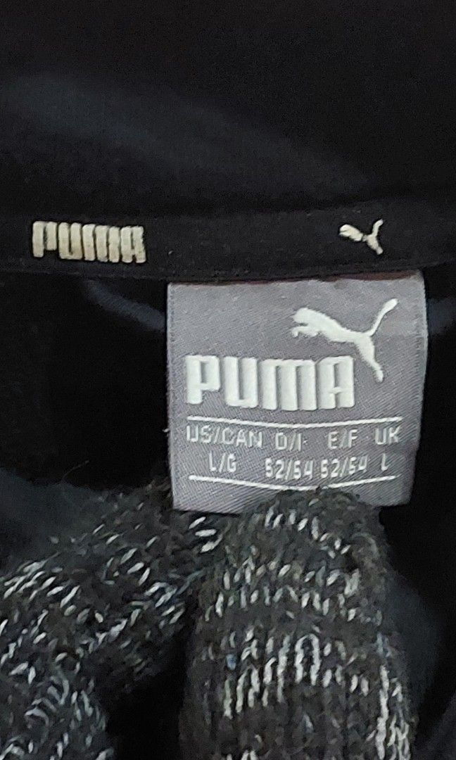 PUMA T7 Track Jacket (Category: Activewear) located in Pozorrubio. Submitted by infinite_grind_0.1 (Listing ID 1466669260, Image 2). Description: 450 This is a classic black PUMA T7 Track Jacket featuring distinct white logo taping along both sleeves. on tape: chest 23 length 26.