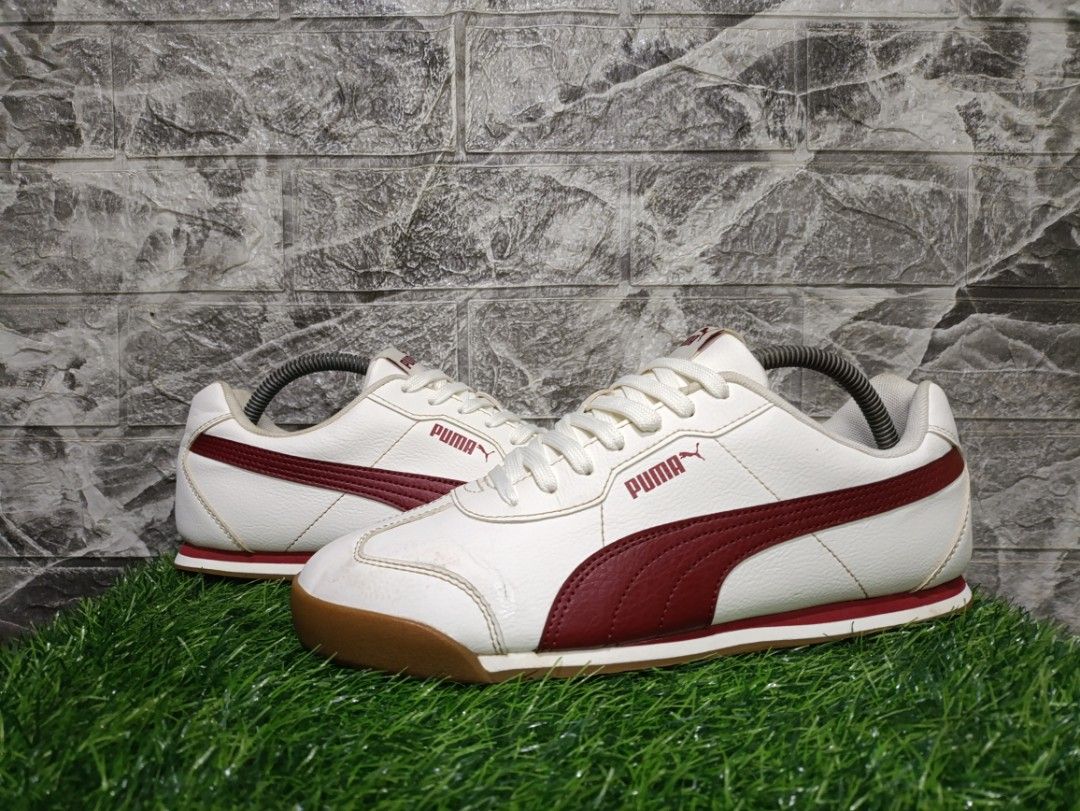 Puma Torino ll (Category: Casual Shoes) located in Davao. Submitted by tomcarbon11 (Listing ID 1466725265, Image 1). Description: - Brand/Model: Authentic Puma low-top sneakers - Colorway: Crisp white upper with rich deep maroon stripes - Soles: Classic gum rubber outsoles for better grip and vintage appeal - Details: Gold foil Puma logo on the sides, red branding on tongue and heel tabs - Fit/Design: Structured toe caps with classic white laces 