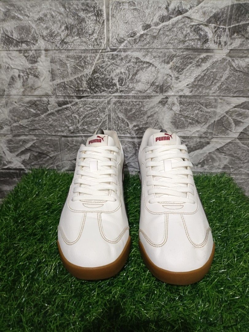 Puma Torino ll (Category: Casual Shoes) located in Davao. Submitted by tomcarbon11 (Listing ID 1466725265, Image 3). Description: - Brand/Model: Authentic Puma low-top sneakers - Colorway: Crisp white upper with rich deep maroon stripes - Soles: Classic gum rubber outsoles for better grip and vintage appeal - Details: Gold foil Puma logo on the sides, red branding on tongue and heel tabs - Fit/Design: Structured toe caps with classic white laces 
