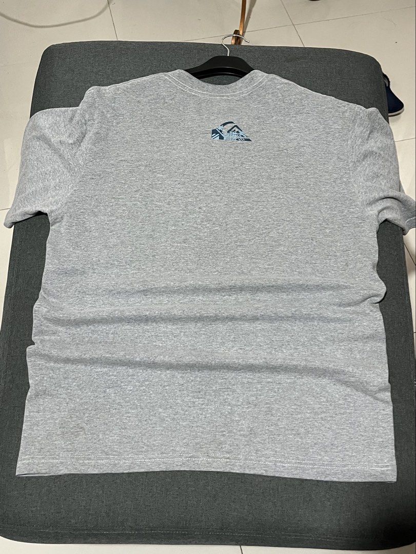 Quiksilver Grey T-Shirt Size L (Category: Tshirts & Polo Shirts ) located in Manila. Submitted by jackel15 (Listing ID 1466719655, Image 2). Description: - Brand: Quiksilver - Size: Large - Material: 100% Cotton (Made in Thailand) - Color: Grey with blue and white graphics - Design: Big chest logo and small matching upper back print - Fit: Standard crew neck with short sleeves - Condition/Vibe: Comfortable everyday casual wear.