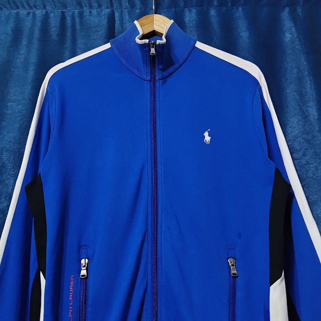 RALPH LAUREN PERFORMANCE FULL ZIP TRSCK JACKET (Category: Coats, Jackets and Outerwear) located in Makati City. Submitted by upcycled.closeth (Listing ID 1466595827, Image 3). Description: - Authentic Polo Ralph Lauren product - Royal blue, Long-sleeved - Size: small to Medium (men's) - Like new - Authentic - flaws: no flaws - Excellent condition - Need wash, fresh from bale - Features design of Ralph Lauren performance full zip jacket - Material