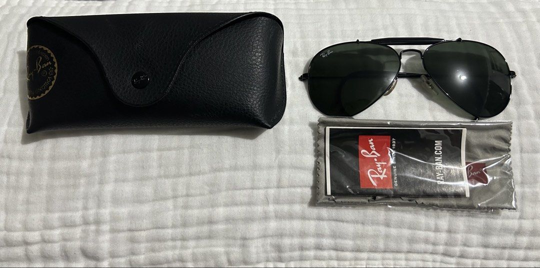 Ray-Ban Aviator Sunglasses with Case and Cloth (Category: Sunglasses & Eyewear) located in Dasmarinas. Submitted by lexaquino04 (Listing ID 1466761821, Image 1). Description: !!AUTHENTIC RAY-BAN SUNGLASSES!! - Frame: Sturdy black metal in classic pilot style - Lenses: Classic dark green, clean with no major scratches - Inclusions: Original black leather hard case and sealed logo cleaning cloth - Condition: Excellent, well-maintained pre-loved con