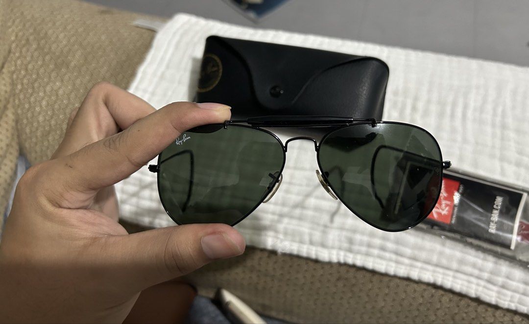 Ray-Ban Aviator Sunglasses with Case and Cloth (Category: Sunglasses & Eyewear) located in Dasmarinas. Submitted by lexaquino04 (Listing ID 1466761821, Image 2). Description: !!AUTHENTIC RAY-BAN SUNGLASSES!! - Frame: Sturdy black metal in classic pilot style - Lenses: Classic dark green, clean with no major scratches - Inclusions: Original black leather hard case and sealed logo cleaning cloth - Condition: Excellent, well-maintained pre-loved con