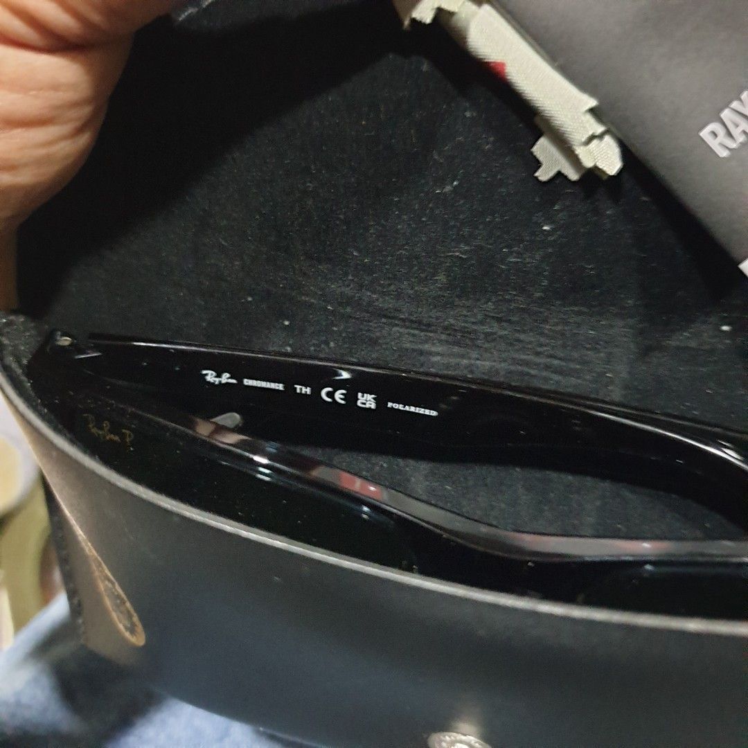 Ray-Ban Chromance Polarized Sunglasses with Case (Category: Sunglasses & Eyewear) located in Iligan City. Submitted by sariranaw (Listing ID 1466709876, Image 3). Description: Ray-Ban sunglasses with Chromance polarized lenses. Glossy black frames, adjustable nose pads. Includes original leather case, cleaning cloth, and product booklet. Lenses feature the Ray-Ban P logo. Clean condition, zero scratches..