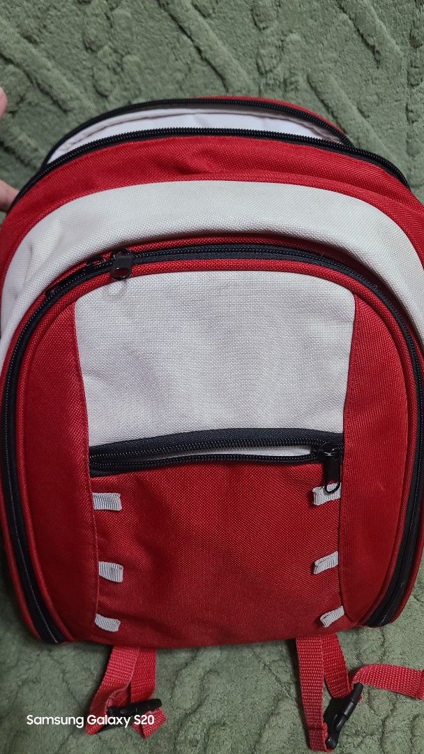 Red and white picnic backpack set with plates and blanket (Category: Backpacks) located in Mandaluyong City. Submitted by Michkam021 (Listing ID 1466765390, Image 3). Description: - Complete picnic set in a stylish red and white backpack - Includes red plastic plates, cups, cutlery, and a cutting board - Comes with a matching plaid blanket - All items pack neatly inside with smooth-working zippers - Ideal for outdoor trips, park dates, and weeken