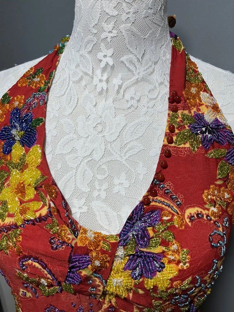 Red Beaded Floral Halter Top (Category: Sleeveless) located in Dagupan City. Submitted by shanadongsb (Listing ID 1466735766, Image 2). Description: - Vibrant red halter top with intricate floral beading and paisley prints - V-neckline accented with red bead trim - Smocked elastic back panel for a comfortable and flexible fit - Adjustable tie-back neck strap - Great statement piece for summer days or nights out.