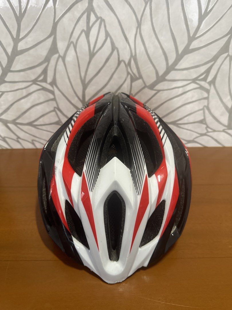 Red Black and White Cycling Helmet (Category: Bicycles) located in Makati City. Submitted by twodoxies (Listing ID 1466609449, Image 2). Description: - Color: Red, black, and white - Adjustable straps with quick-release buckle - Comfortable padded interior with mesh netting for airflow - Lightweight shell with multiple ventilation ports Location: Makati / Las Pinas.