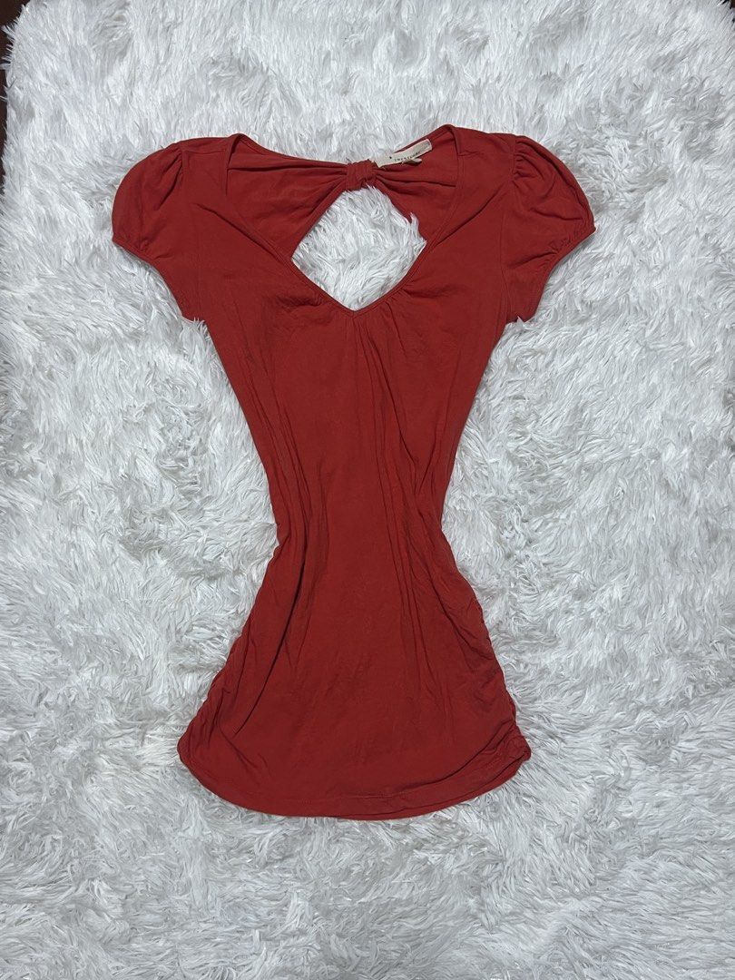 Red Cut-Out Short Sleeve Top (Category: Blouses) located in Tuguegarao City. Submitted by love_clothies (Listing ID 1466605220, Image 1). Description: - Color: Red - Style: Short sleeve top with fitted waist and ruched sides - Detail: Back cut-out with twisted knot accent - Fabric: Soft and stretchy cotton - Fit: Super flattering - Condition: Brand new / Excellent - Perfect for casual wear and daily OOTDs - Size: M on tag, but can fit to Small to
