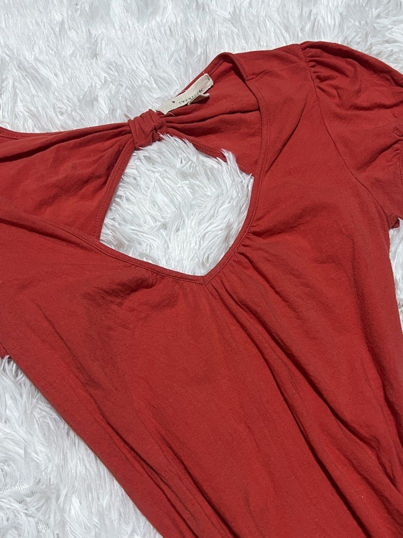 Red Cut-Out Short Sleeve Top (Category: Blouses) located in Tuguegarao City. Submitted by love_clothies (Listing ID 1466605220, Image 3). Description: - Color: Red - Style: Short sleeve top with fitted waist and ruched sides - Detail: Back cut-out with twisted knot accent - Fabric: Soft and stretchy cotton - Fit: Super flattering - Condition: Brand new / Excellent - Perfect for casual wear and daily OOTDs - Size: M on tag, but can fit to Small to