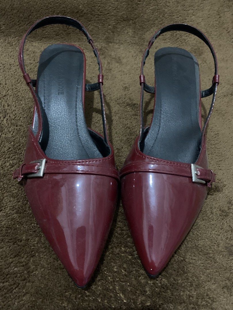 Red Patent Leather Slingback Kitten Heels (Category: Heels) located in Daraga. Submitted by shevvv28 (Listing ID 1466694661, Image 1). Description: (ONCE USED: Pinag xmas party lang year 2025 and di na nasuot) - Style: Burgundy slingback heels with pointed toes and low sculpted heels - Finish: Shiny patent leather-look with front strap buckle detail - Comfort: Walkable low heel height, cushioned black insoles, and secure back strap - Versatility: