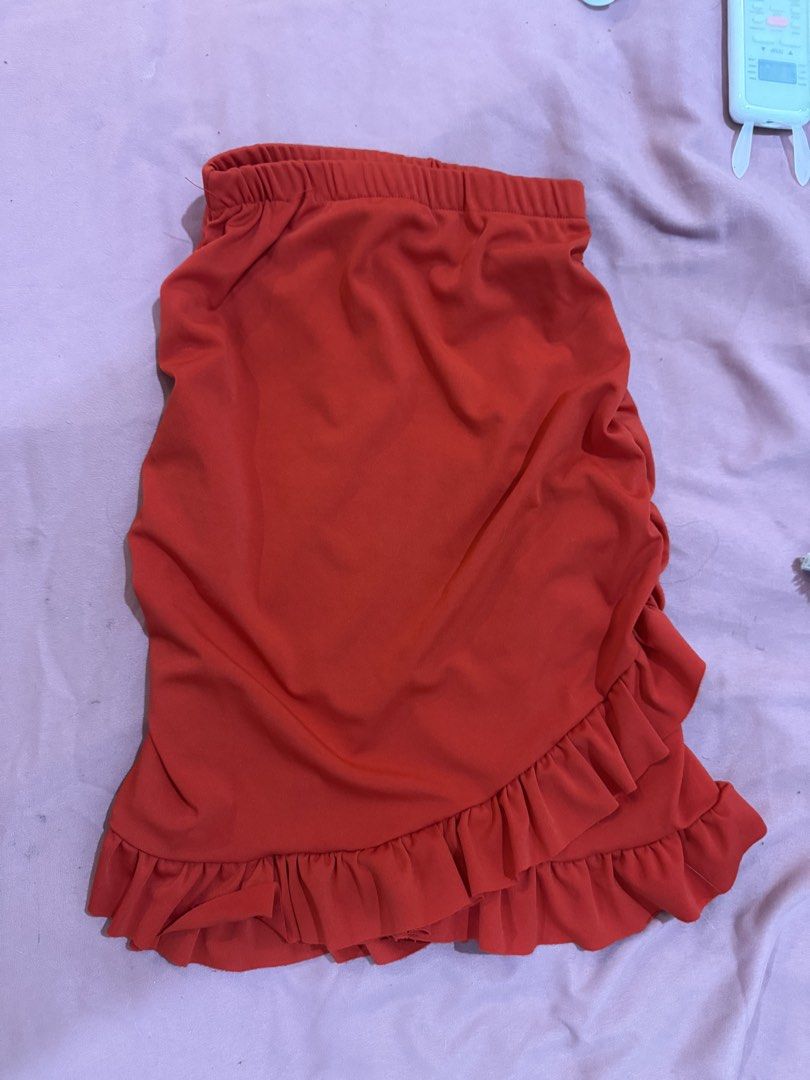 Red ruffled mini skirt elastic waist (Category: Skirts) located in Manila. Submitted by mightystone-d948cd (Listing ID 1466771860, Image 2). Description: - Color: Vibrant red - Style: Mini skirt with a diagonal layered ruffle hem - Waistband: Elastic for an easy, comfortable fit - Fabric: Smooth and lightweight - Occasion: Great for casual daytime wear or nights out - Note: Measurements and fit details available upon request.