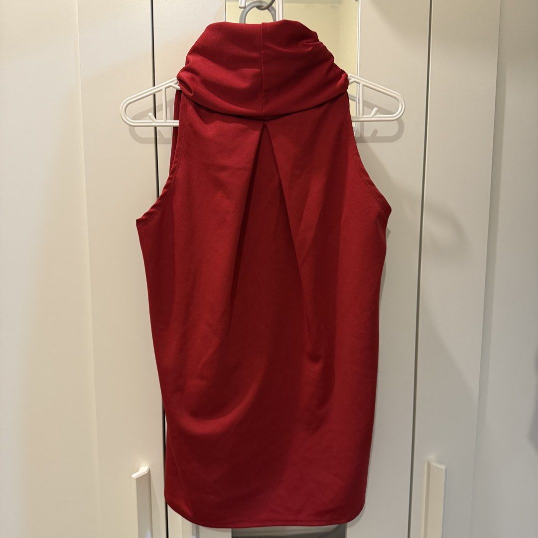 Red Sleeveless Cowl Neck Top (Category: Sleeveless) located in Marikina City. Submitted by lovegoeson (Listing ID 1466684751, Image 3). Description: - Color: Rich red - Style: Sleeveless with a flattering cowl neck - Details: Upper back pleats for added style - Fit: Relaxed through the body - Fabric: Smooth, stretchy, and soft - Versatility: Easy to pair with jeans or skirts for casual days.