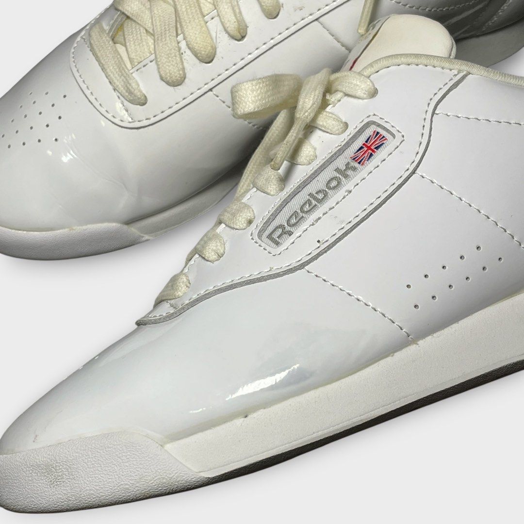 Reebok x Junya Watanabe - Patent Leather Trainers (Category: Sneakers) located in Los Banos. Submitted by declutterking (Listing ID 1466664918, Image 3). Description: Size 7 (24 cm) • round-toes • lace-up closure • blueish stains and leather peels • pair only Excellent condition Authentic.