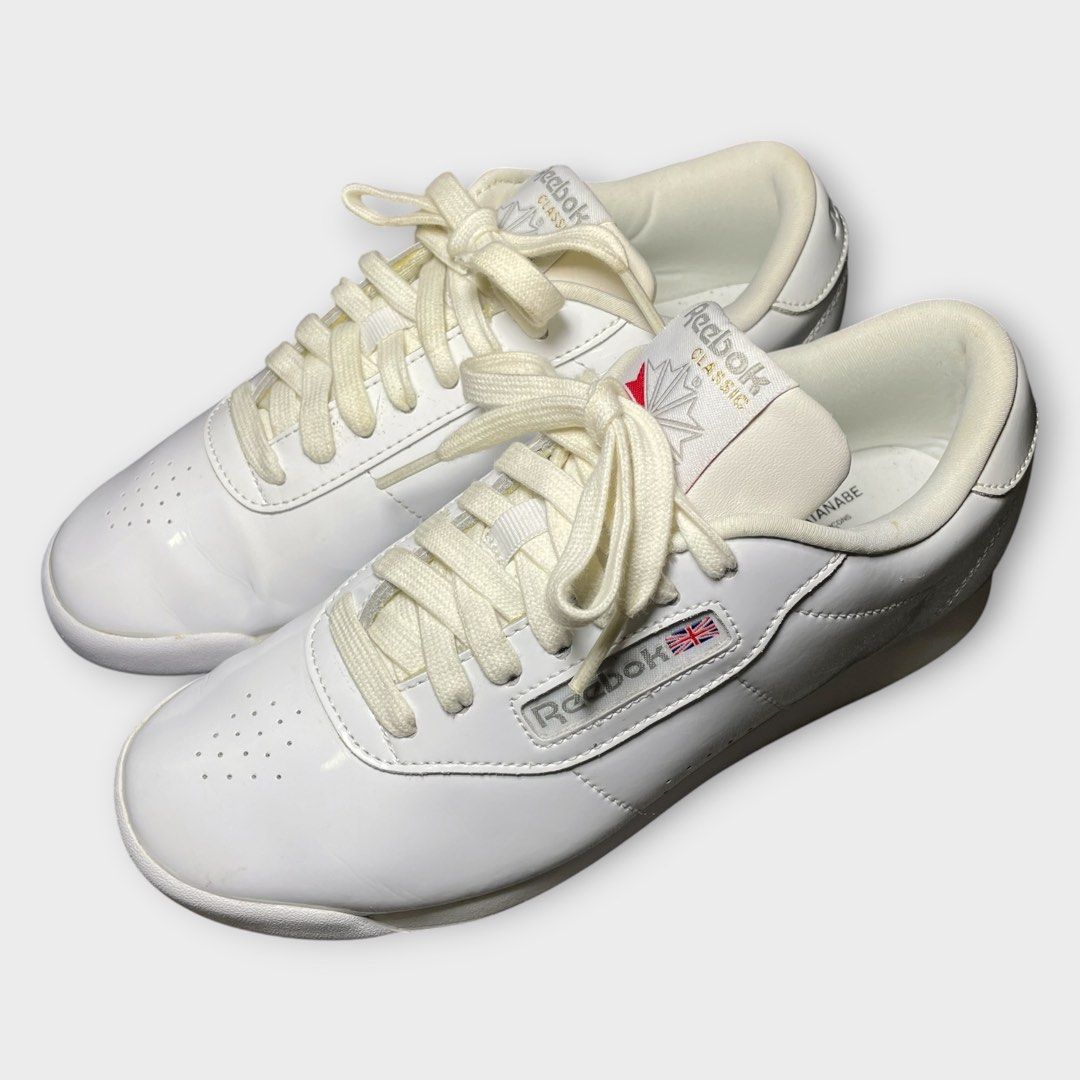 Reebok x Junya Watanabe - Patent Leather Trainers (Category: Sneakers) located in Los Banos. Submitted by declutterking (Listing ID 1466664918, Image 2). Description: Size 7 (24 cm) • round-toes • lace-up closure • blueish stains and leather peels • pair only Excellent condition Authentic.