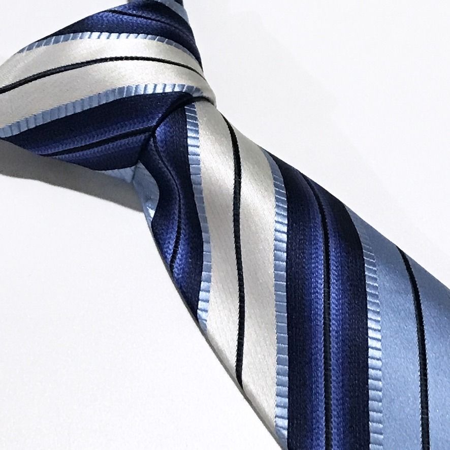 Reserve Deep Navy Textured Striped Hand Made Neck Tie (Category: Ties) located in Taguig. Submitted by retrogaze (Listing ID 1466595613, Image 1). Description: This handmade necktie by Reserve features a rich, deep navy blue base crafted with an interwoven multi-textured weave. The body is styled in a dynamic diagonal stripe pattern incorporating alternating bands of royal navy, light cornflower blue, silver-white satin, and subtle ladder-stitche