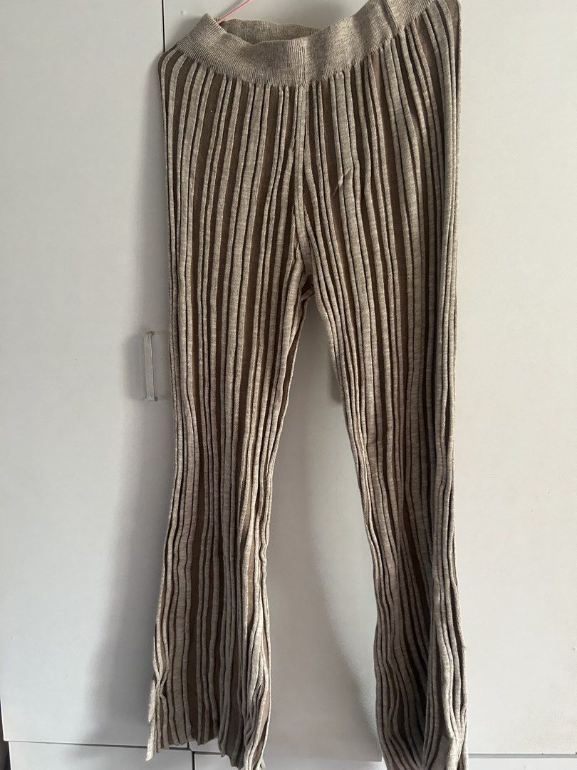 Ribbed knit flare pants beige brown (Category: Other Bottoms) located in Quezon City. Submitted by emayeah (Listing ID 1466575760, Image 2). Description: - Color/Pattern: Beige and brown stripes - Material: Super stretchy, lightweight ribbed knit - Fit: High waist with a comfy elastic waistband - Style: Flared legs at the bottom - Versatility: Great for lounging at home or styling with oversized tees and sweaters Never been used.