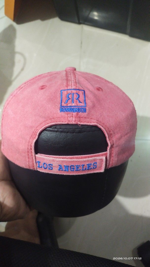 Robin Ruth Los Angeles Pink Baseball Cap (Category: Caps & Hats) located in Manila. Submitted by rhobin.m08 (Listing ID 1466704903, Image 2). Description: - Brand: Robin Ruth - Color: Pink with bold blue 'Los Angeles' and 'Original 1848' embroidery on front and back - Material: 100% breathable cotton - Fit: Adjustable strap in the back for a custom fit - Details: Features branded interior taping - Condition: Excellent, perfect for everyday casual