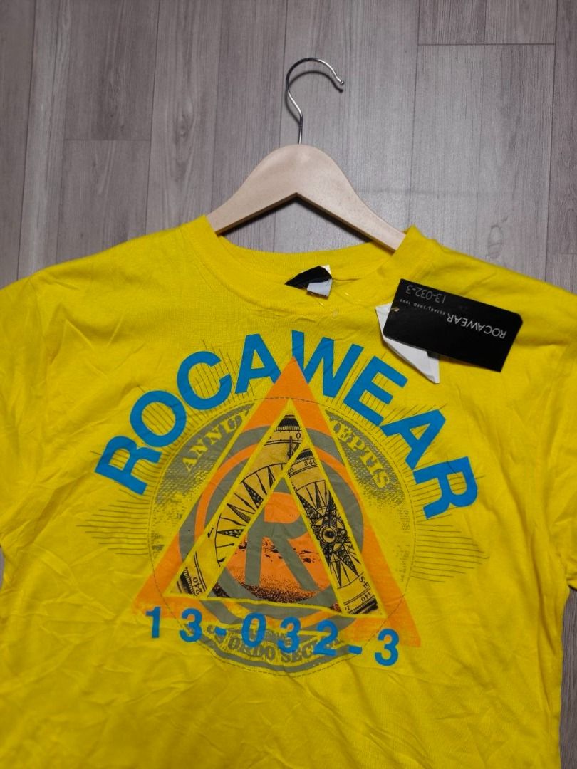 ROCAWEAR PYRAMID MASONIC GRAPHIC TEE - DANDELION (Category: Tshirts & Polo Shirts ) located in Manila. Submitted by ztfirtfritz (Listing ID 1466683617, Image 2). Description: ROCAWEAR PYRAMID MASONIC GRAPHIC TEE - DANDELION LEGIT BRAND NEW WITH TAG (DEADSTOCK) LARGE MEASUREMENTS" SHOULDER: 20 SLEEVE: 9 PIT: 21 LENGTH: 28 EXCELLENT 400 + SF.