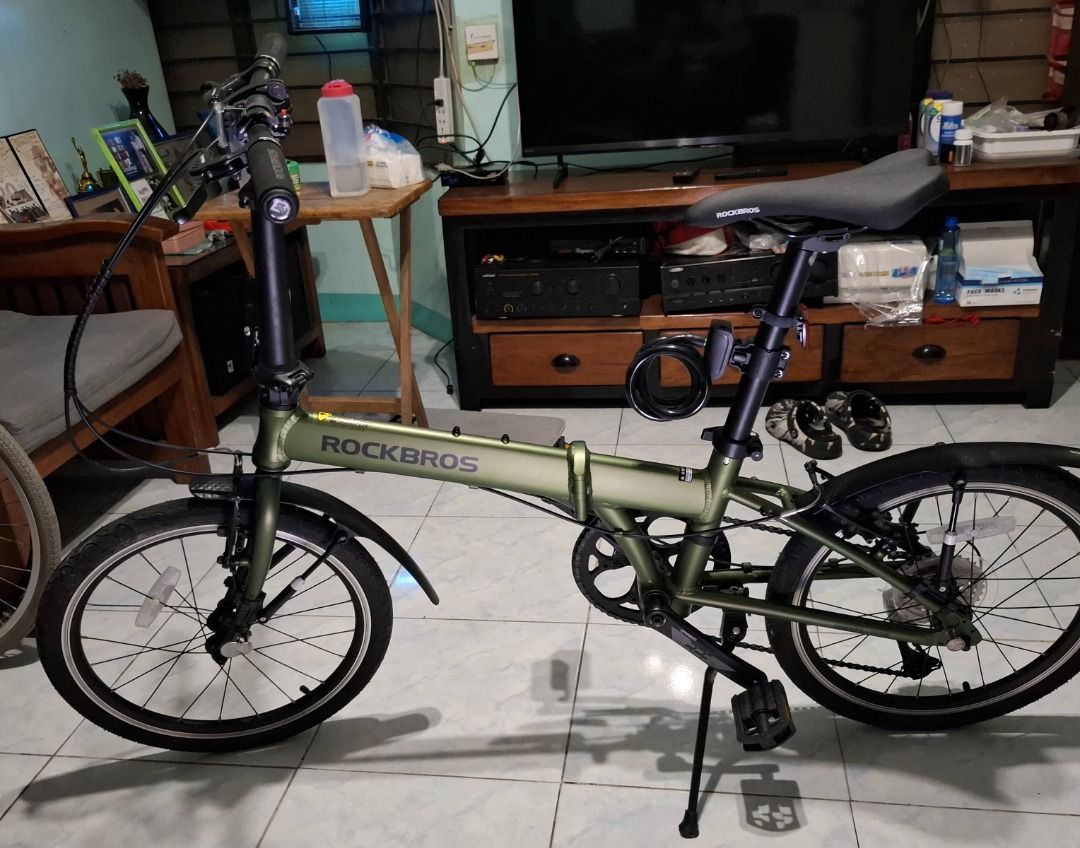 Rockbros Olive Green Folding Folding Bicycle (Category: Bicycles) located in Taguig. Submitted by wildforest.2e186a (Listing ID 1466610660, Image 1). Description: Selling my ROCKBROS 20" -Bihira lang nagamit looks NEW -Aluminium alloy frame -High carbon steel front fork -Bike weight:11.32KG -Shimano 8-speed -Kenda tires 20 inches -Prowheel crankset -Load Capacity:100KG -Suggested Height:140-185CM -Front and rear V-brake -Lock Anti-Theft Steel -Bi