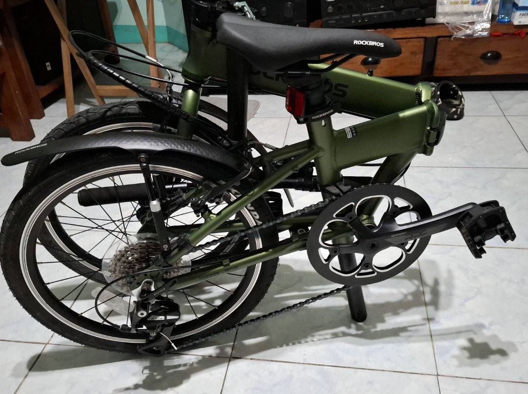 Rockbros Olive Green Folding Folding Bicycle (Category: Bicycles) located in Taguig. Submitted by wildforest.2e186a (Listing ID 1466610660, Image 3). Description: Selling my ROCKBROS 20" -Bihira lang nagamit looks NEW -Aluminium alloy frame -High carbon steel front fork -Bike weight:11.32KG -Shimano 8-speed -Kenda tires 20 inches -Prowheel crankset -Load Capacity:100KG -Suggested Height:140-185CM -Front and rear V-brake -Lock Anti-Theft Steel -Bi