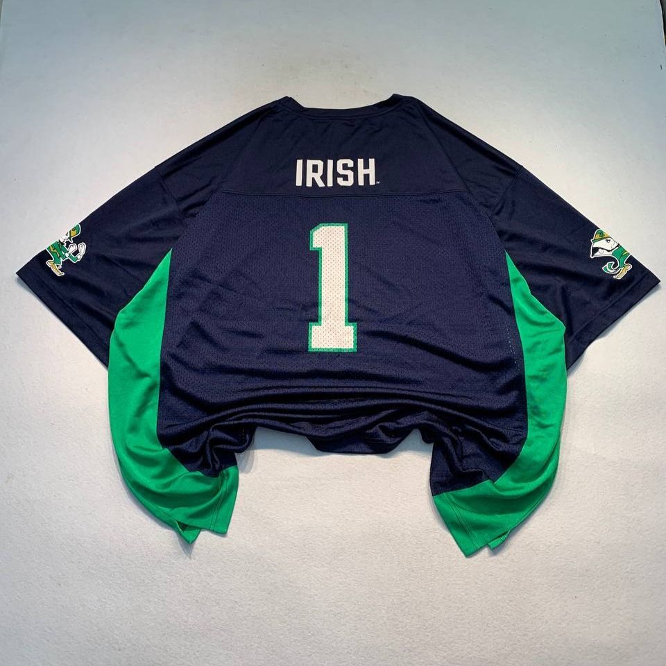 Russell Notre Dame Fighting Irish Jersey (Category: Activewear) located in Mandaluyong City. Submitted by theroom501 (Listing ID 1466685625, Image 2). Description: Russell Notre Dame Fighting Irish Jersey Style Code: Size on Tag: XXL Color: White Condition: Good pre-owned condition with a heavily distressed vintage look. Flaws/Issues: None Flat Lay Measurements: Pit to Pit: 29 inches Length: 32 inches Arm opening Length: 9.5 inches Price: 1000.