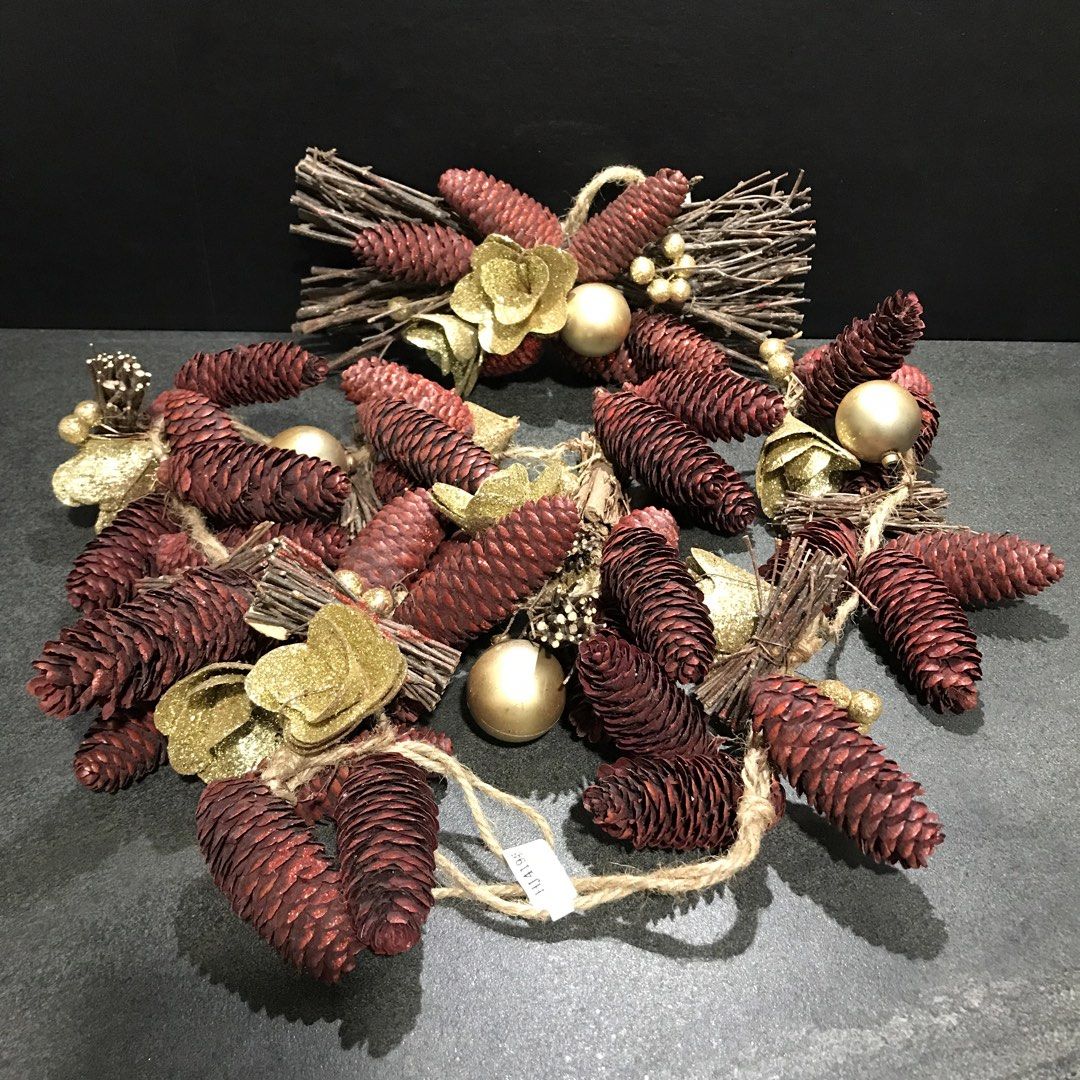 Rustic Pine Cone Christmas Wreath with Gold Ornaments (Category: Wall Decor) located in Baao. Submitted by all.things.japan (Listing ID 1466715011, Image 2). Description: - Festive holiday wreath featuring dried twigs, dark red pine cones, and metallic gold flowers - Accented with shiny gold baubles and glittery berry clusters - Equipped with a rustic jute string loop for effortless hanging on doors or walls - Ideal for adding a touch of Christma