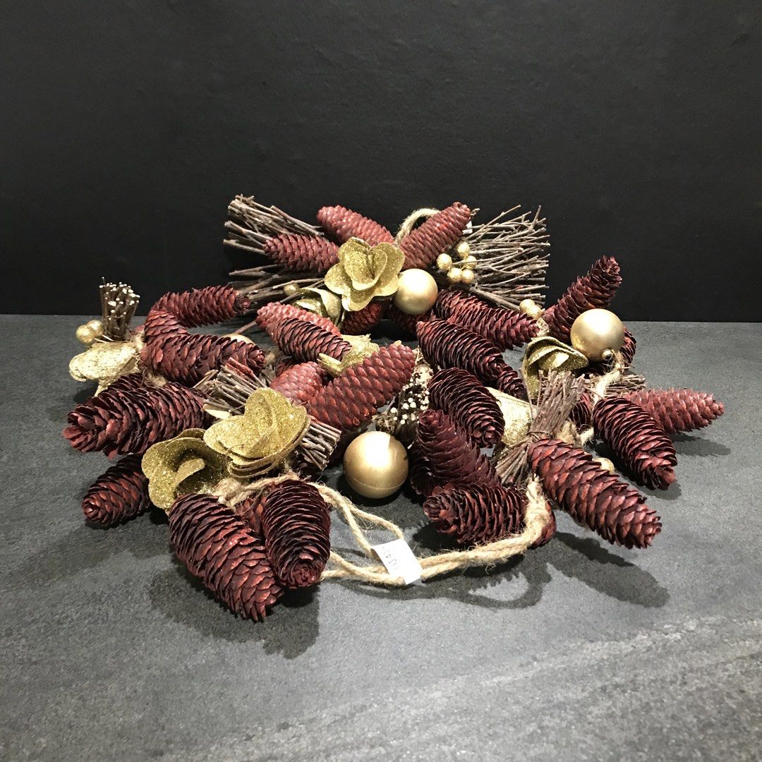 Rustic Pine Cone Christmas Wreath with Gold Ornaments (Category: Wall Decor) located in Baao. Submitted by all.things.japan (Listing ID 1466715011, Image 1). Description: - Festive holiday wreath featuring dried twigs, dark red pine cones, and metallic gold flowers - Accented with shiny gold baubles and glittery berry clusters - Equipped with a rustic jute string loop for effortless hanging on doors or walls - Ideal for adding a touch of Christma
