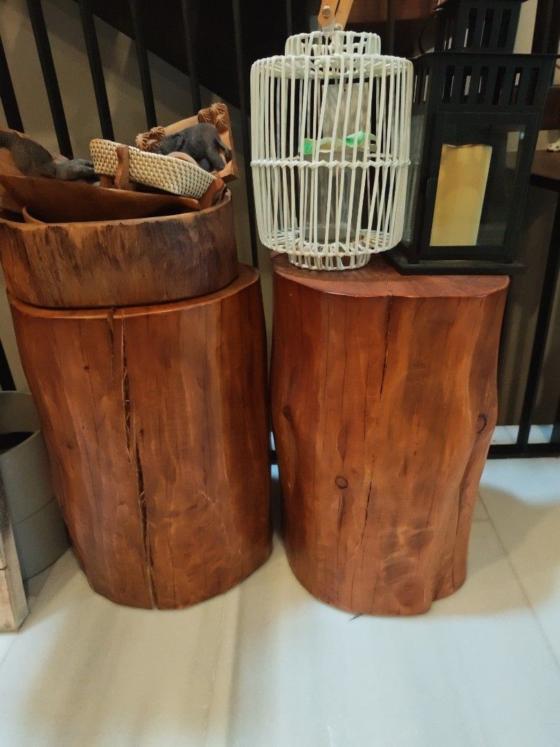Rustic solid wood log stools pair (Category: Chairs) located in Singapore. Submitted by vooooooo (Listing ID 1466603523, Image 2). Description: - Solid wooden log stools - Rich brown finish with beautiful natural wood grain - Heavy, sturdy, and durable build - Unique raw character with natural wood splits on the sides - Multi-purpose: use as side tables, plant stands, or extra indoor seating 150sgd each.