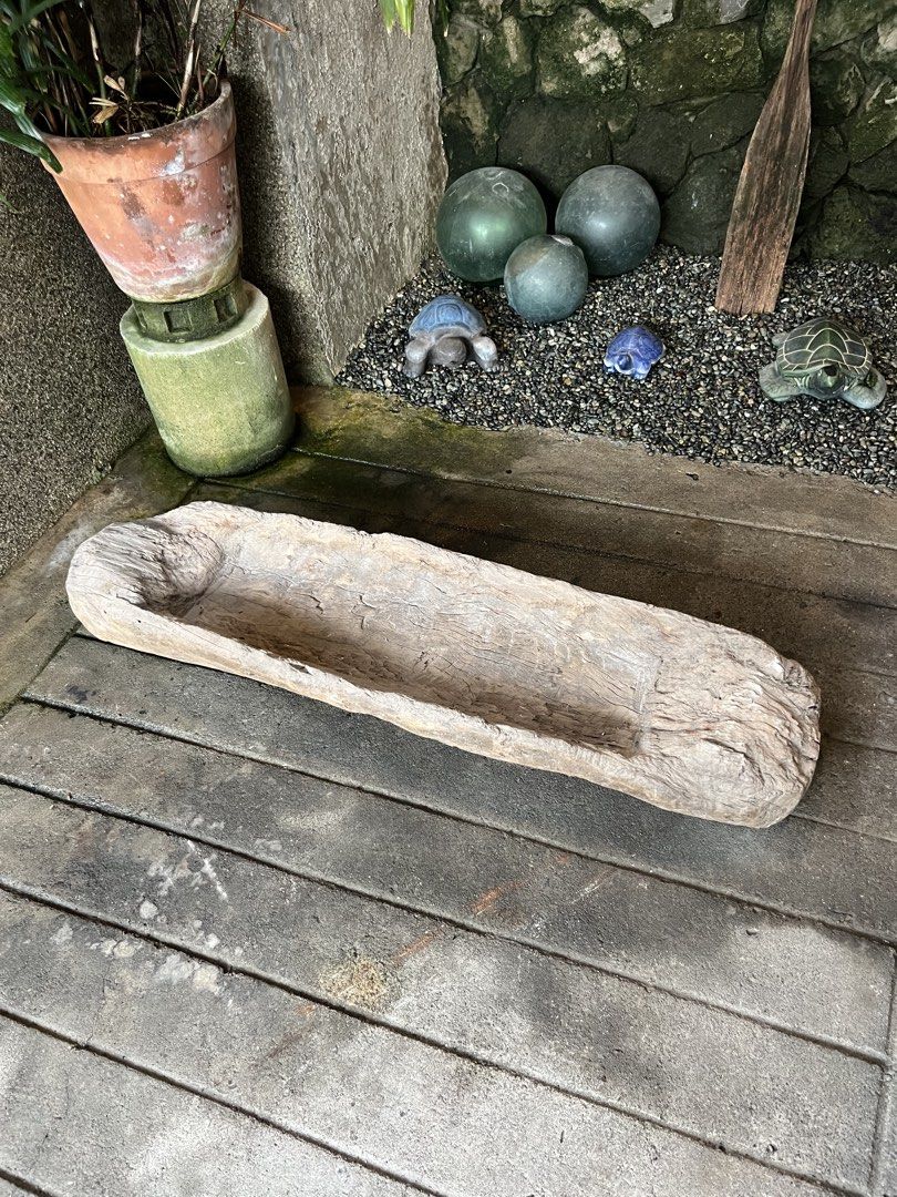 Rustic wooden trough carved basin decor (Category: Shelves, Cabinets & Racks) located in Quezon. Submitted by vintage66 (Listing ID 1466682010, Image 2). Description: - Material: Solid wood with natural grain and weathered texture - Design: Long, rectangular trough with a deep carved basin and rough natural edges - Condition: Shows authentic wear from age, adding to its rustic charm - Versatile Use: Ideal for garden decoration, holding plants, or