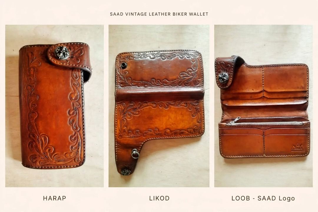 SAAD Leather Long Wallet Tooled Design (Category: Wallets & Card holders) located in Santa Cruz. Submitted by freeturtle_2610 (Listing ID 1466764490, Image 1). Description: - Brand: SAAD - Material: Genuine leather in tan brown - Exterior: Hand-tooled floral carved pattern with a snap button closure and decorative metal concho - Interior: Multiple card slots, spacious bill compartments, and a zippered coin pocket - Details: Stamped with the SAAD 