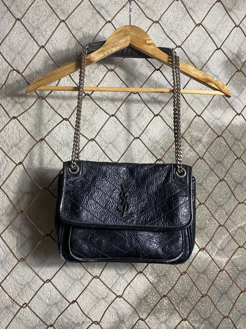 Saint Laurent College Chain Bag Black (Category: Shoulder Bags) located in Cabanatuan. Submitted by adrialesdrip (Listing ID 1466684670, Image 1). Description: - Brand: Saint Laurent - Style: Shoulder Bag / Flap Bag - Material: Black crinkled leather with chevron quilting - Hardware: Dark metal with engraved branding - Closure: Front flap with signature interlocking YSL logo - Details: Chain straps through metal grommets, debossed interior logo -