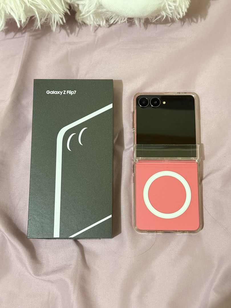 Samsung Galaxy Flip 7 (Category: Samsung) located in Las Pinas. Submitted by smnngale (Listing ID 1466725997, Image 1). Description: ☆ Brand/Model: Samsung Galaxy Z Flip 7 ☆ Storage & RAM: 256GB / 12GB ☆ Color: Coral Red ☆ Condition: Excellent, lightly used / extra phone ☆ Inclusions: Original box, original Type C cable, and clear protective case with magnetic ring ☆ Reason for selling: Decluttering ☆ Mode of Delivery: Meet-up only (SM Mall of As