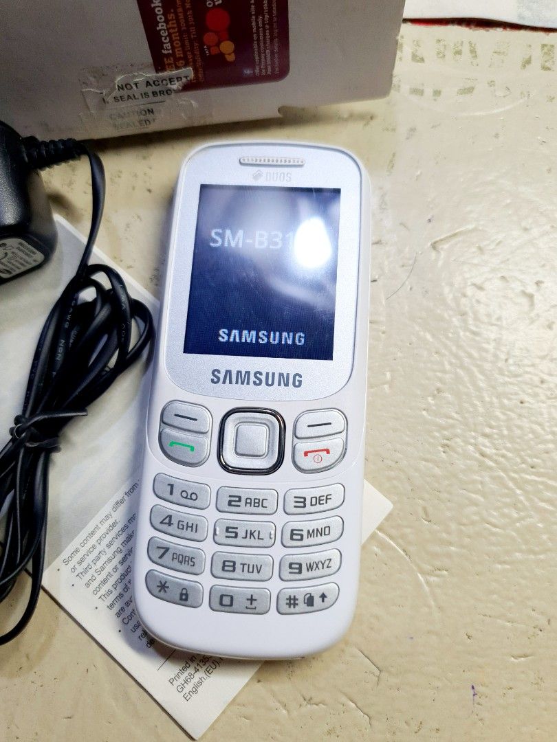 Samsung Keypad phone (Category: Samsung) located in Caloocan City. Submitted by mack.bay (Listing ID 1466733486, Image 3). Description: SAMSUNG Keypad Phone -Model: SM-B312E -Color: White -BRAND NEW, NEVER USED -NO ISSUE at ALL. - TESTED - OK👍✅ One of the Best Samsung Keypad cp. durable We purchased it supposedly for our Mother back up phone for PLDT Sim, but she don't like it. it's too small. Insclusions: Complete in a box. Keypad phone Charger