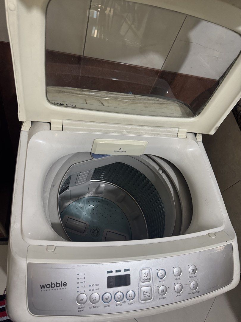 Samsung Wobble Technology 6.5kg Top Load Washing Machine (Category: Washing Machines and Dryers) located in Manila. Submitted by cleverwolf.b19493 (Listing ID 1466620647, Image 3). Description: - Brand: Samsung - Capacity: 6.5kg top load - Technology: Wobble technology for gentle yet thorough cleaning - Wash Cycles: Fuzzy, quick, delicates, blanket, jeans, and eco tub clean - Features: Digital control panel, adjustable water levels, and air turbo