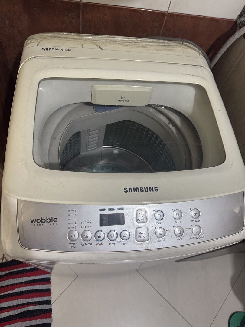 Samsung Wobble Technology 6.5kg Top Load Washing Machine (Category: Washing Machines and Dryers) located in Manila. Submitted by cleverwolf.b19493 (Listing ID 1466620647, Image 1). Description: - Brand: Samsung - Capacity: 6.5kg top load - Technology: Wobble technology for gentle yet thorough cleaning - Wash Cycles: Fuzzy, quick, delicates, blanket, jeans, and eco tub clean - Features: Digital control panel, adjustable water levels, and air turbo