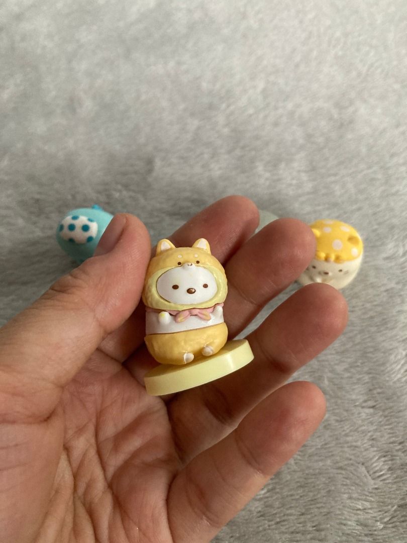 San-X Sumikko Gurashi Character Figures (Category: Designer & Blind Box Toys) located in Rizal. Submitted by sheeraay (Listing ID 1466653450, Image 2). Description: - Set of 4 authentic Sumikko Gurashi mini figures from San-X - Features lovable characters in cute animal and hat costumes - Includes a display base for the dog costume figure - Official 2023 San-X stamp on the bottom base - High-quality, detailed paintwork on every piece - Perfect co