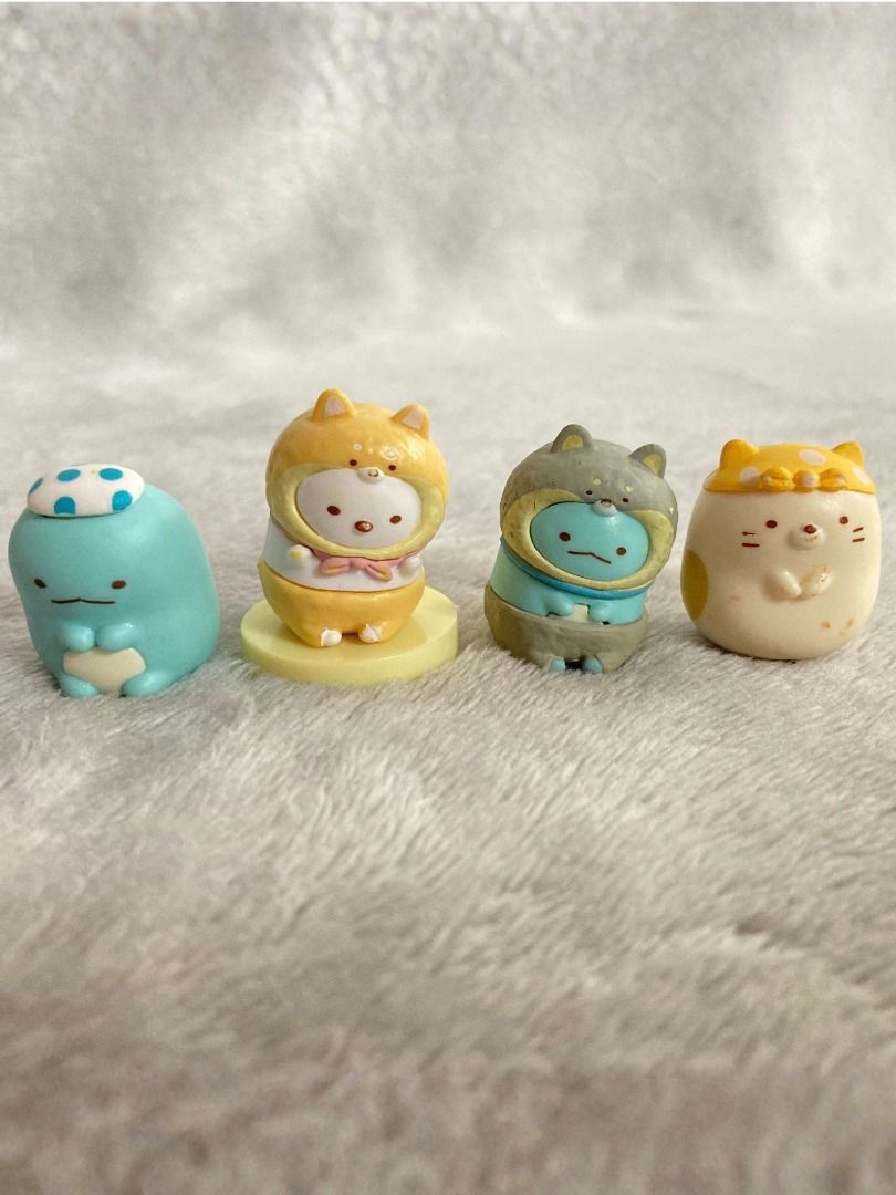 San-X Sumikko Gurashi Character Figures (Category: Designer & Blind Box Toys) located in Rizal. Submitted by sheeraay (Listing ID 1466653450, Image 1). Description: - Set of 4 authentic Sumikko Gurashi mini figures from San-X - Features lovable characters in cute animal and hat costumes - Includes a display base for the dog costume figure - Official 2023 San-X stamp on the bottom base - High-quality, detailed paintwork on every piece - Perfect co