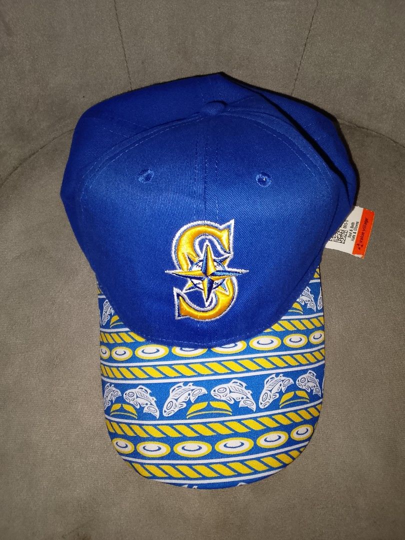 Seattle Mariners Inspired Blue & Gold Patterned Baseball Cap (Category: Caps & Hats) located in Binangonan. Submitted by yuristalin888 (Listing ID 1466711516, Image 3). Description: A stylish blue baseball cap featuring an embroidered compass-style S logo in gold and white, paired with a distinctive blue-and-gold patterned brim decorated with nautical-inspired motifs. Made from cotton with an adjustable back closure, this unique cap combines spor