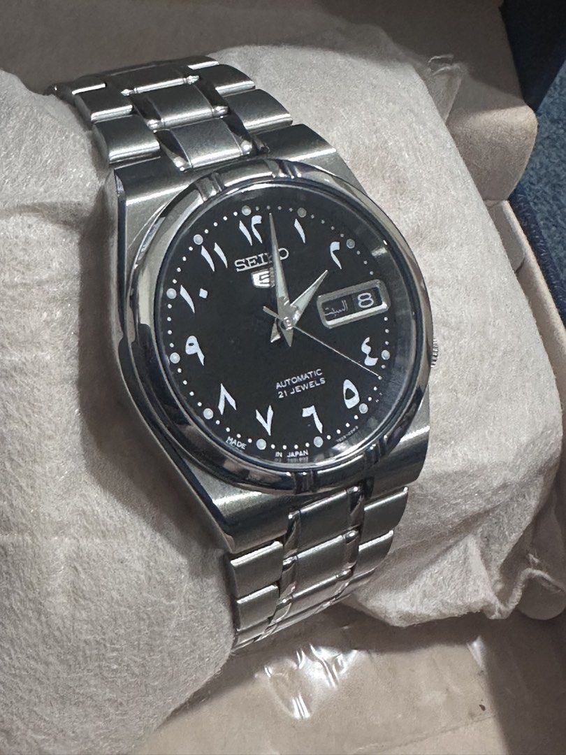 Seiko 5 Arabic Dial SNK063J5 Automatic Watch (Category: Men's Watches) located in Makati City. Submitted by rnavarrojr (Listing ID 1466719311, Image 2). Description: - Brand: Seiko 5 Automatic - Model / Ref: SNK063J5 (Made in Japan) - Movement: Calibre 7S26, 21 Jewels - Dial: Black with Arabic numerals - Material: Stainless steel case and bracelet - Case Back: Exhibition glass back - Inclusions: Original box, tag, and extra links.