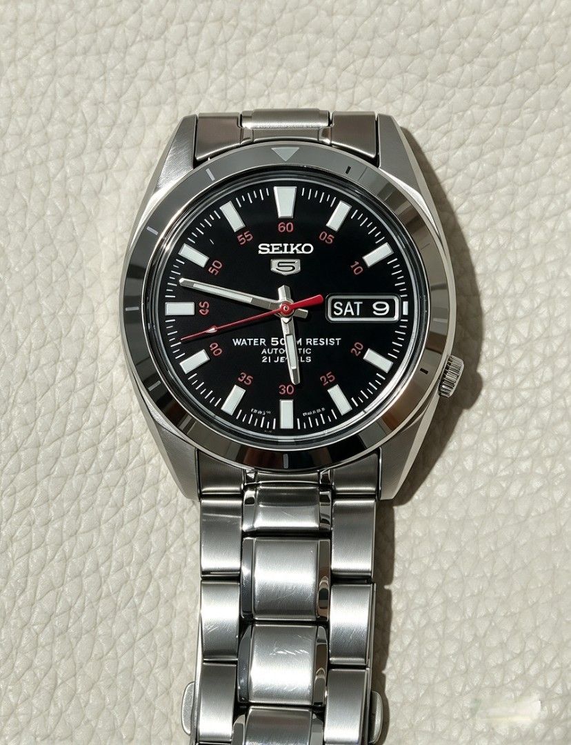 Seiko 5 Automatic Stainless Steel Watch (Category: Men's Watches) located in Caloocan City. Submitted by swiftwater_9c01d6 (Listing ID 1466572253, Image 1). Description: Original Seiko 5 automatic made in japan 7S26-03D0..Luminous glow in the dark.."Day-Date" Seiko 5 automatic watch with a striking black dial and red second hand. Day-date window sits at three o'clock. Stainless steel case paired with matching metal bracelet. Exhibition caseback r