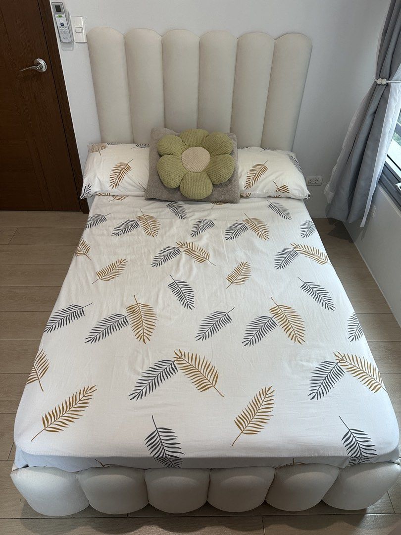 Semi-Double Sized Cloud Bed Frame (Category: Bed Frames & Mattresses) located in Mandaluyong City. Submitted by ireneangelinee (Listing ID 1466614427, Image 2). Description: - Size: Semi-double (48" x 75") - Color: Neutral cream - Design: Unique vertical channeled headboard and pillowed base - Build: Sturdy construction with clean upholstery - Inclusions: Bed frame only (mattress, decorative pillows, and bed covers are NOT included).