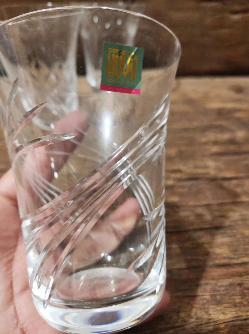 Set of four crystal cut drinking glasses with assorted patterns (Category: Dinnerware & Cutlery) located in Caloocan City. Submitted by chonadura91470 (Listing ID 1466769581, Image 3). Description: - Set of 4 crystal drinking glasses - Features 4 distinct cut patterns: bamboo, leaves, diamond crosshatch, and vertical lines - Heavy base construction for a premium feel - Excellent clear and bright condition (no chips or cracks) - Versatile use for 