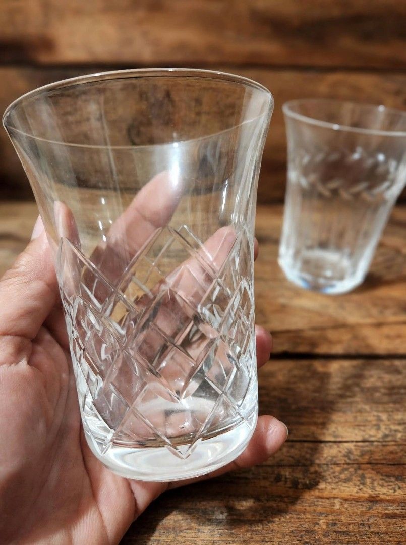 Set of four crystal cut drinking glasses with assorted patterns (Category: Dinnerware & Cutlery) located in Caloocan City. Submitted by chonadura91470 (Listing ID 1466769581, Image 2). Description: - Set of 4 crystal drinking glasses - Features 4 distinct cut patterns: bamboo, leaves, diamond crosshatch, and vertical lines - Heavy base construction for a premium feel - Excellent clear and bright condition (no chips or cracks) - Versatile use for 