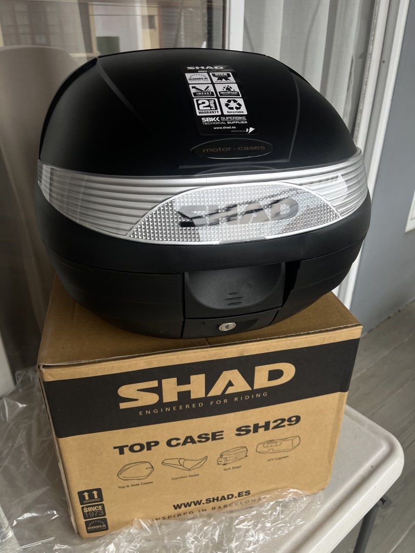 SHAD SH29 Motorcycle Top Case Storage Box (Category: Looking For) located in Paranaque City. Submitted by midnightsky777 (Listing ID 1466595777, Image 1). Description: - Brand new, unused SHAD SH29 motorcycle top case in sleek black - Spacious storage designed to safely hold helmets and essential riding gear - Features built-in waterproof sealing and tough, impact-resistant materials - Complete with original cardboard packaging and inner protecti