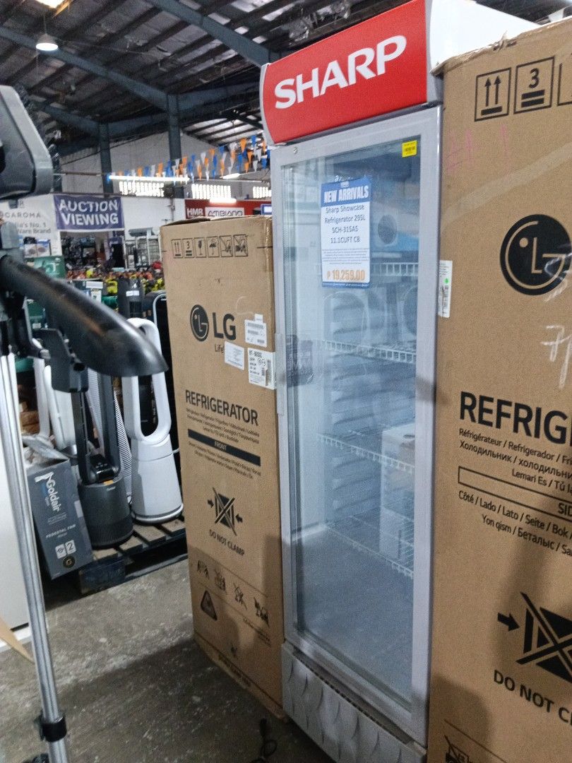Sharp Showcase Refrigerator 295L SCH-315AS 11.1CUFT (Category: Refrigerators and Freezers) located in Manila. Submitted by jesicahmrsantarosa (Listing ID 1466600017, Image 2). Description: Sharp showcase glass door refrigerator. Model SCH-315AS, 295 liters capacity, 11.1 cubic feet. Multiple wire shelves inside for organization. Clear glass front for easy viewing of contents. Red top branding panel. Great for drinks, retail setups, or extra stora