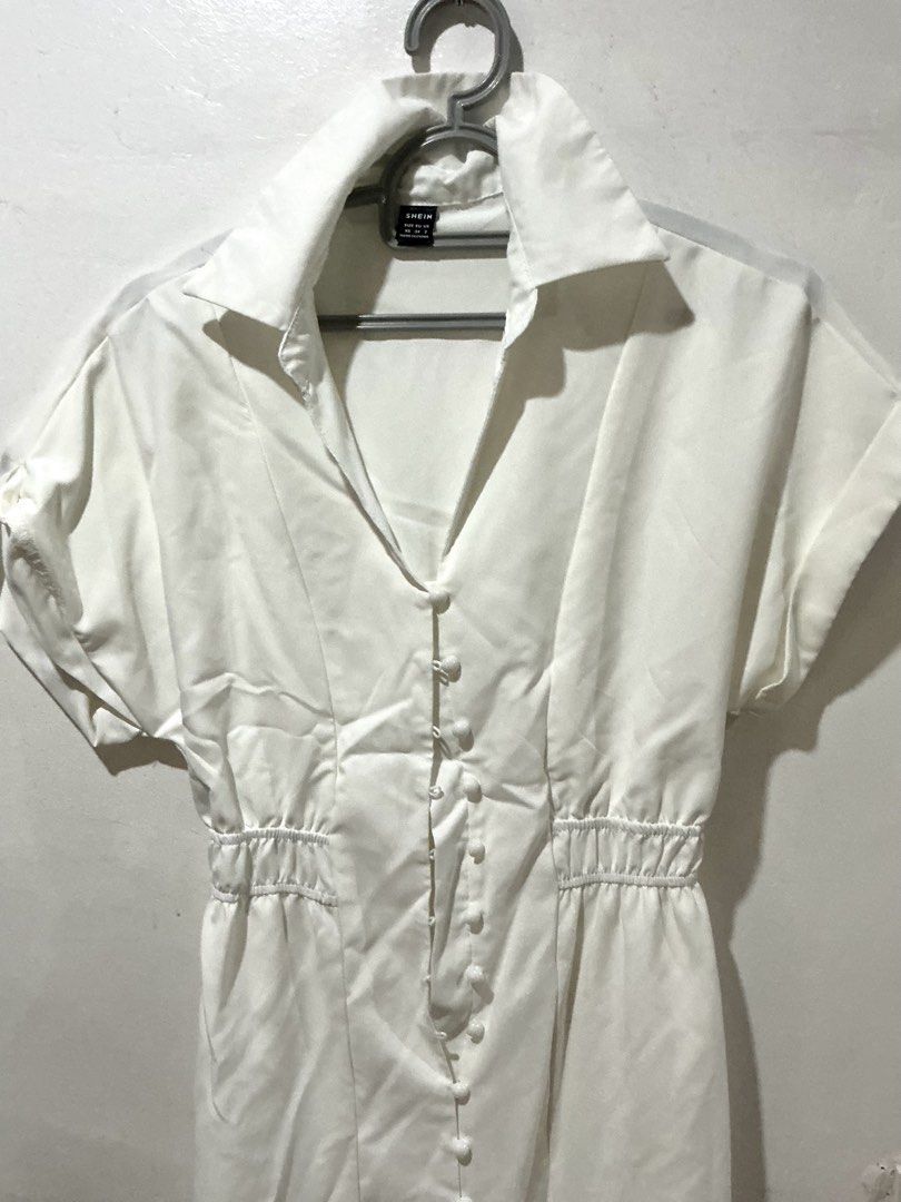 SHEIN Button Up White Dress (Category: Dresses) located in San Pedro. Submitted by itsannabg (Listing ID 1466603692, Image 2). Description: - Brand: SHEIN - Style: White midi shirt dress with lapel collar and short sleeves - Closure: Full front button closure - Fit: Smocked elastic waist for a fitted silhouette - Material: Lightweight fabric - Size: XS (EU 34, US 2) - Condition: Clean, worn only once for my child Baptism.