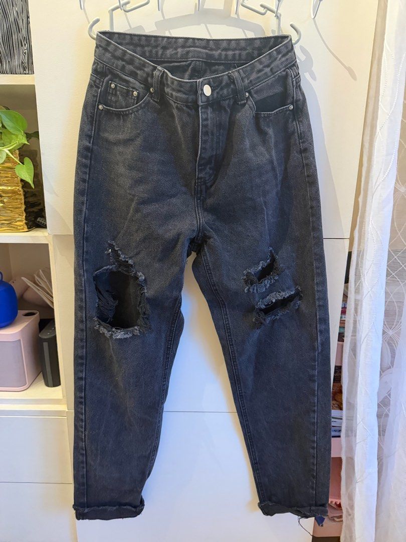 SHEIN Distressed Black Denim Jeans Size M (Category: Jeans) located in Quezon City. Submitted by bubspreloved (Listing ID 1466721154, Image 1). Description: - Brand: Shein - Size: Medium (Brand new with tag attached) - Color: Black wash - Rise: Mid-rise fit - Details: Ripped knees and trendy raw rolled cuffs - Closure: Standard button and zip fly - Pockets: Classic five-pocket design.