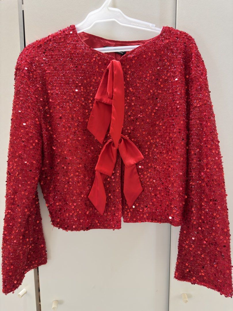 SHEIN Red Sequin Bow Jacket (Category: Coats, Jackets and Outerwear) located in Makati City. Submitted by swiftrabbit.c64f48 (Listing ID 1466612109, Image 1). Description: - Brand: SHEIN - Size: M (EU 38, US 6) - Color: Bright red with all-over shiny sequins - Details: Satin bow front accent with hook-and-eye closure - Fit: Cropped length with long sleeves, fully lined - Condition: Great statement piece for parties and festive events.
